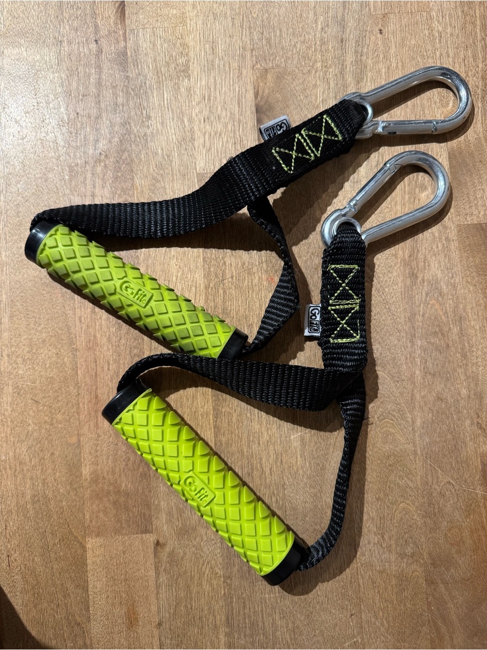 Green Grip Handles with Carabiners for cables or resistance tubes.